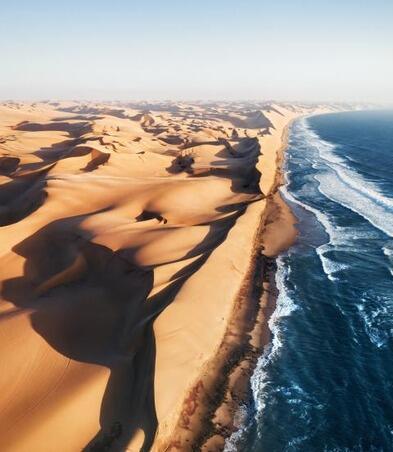 Aerial photo of where the Namib desert and the Atlantic ocean