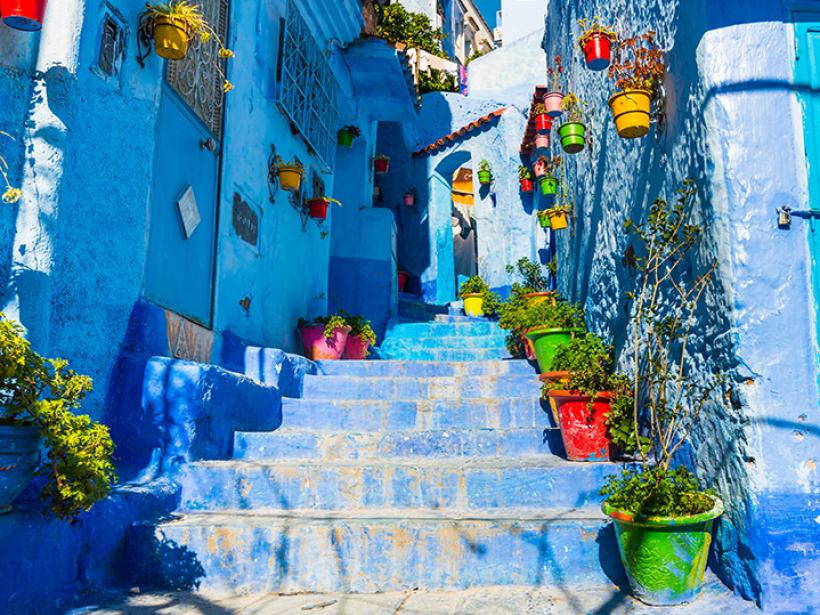 Walk the streets of Chefchaouen, known for its blue-washed walls, weaving, and leather work