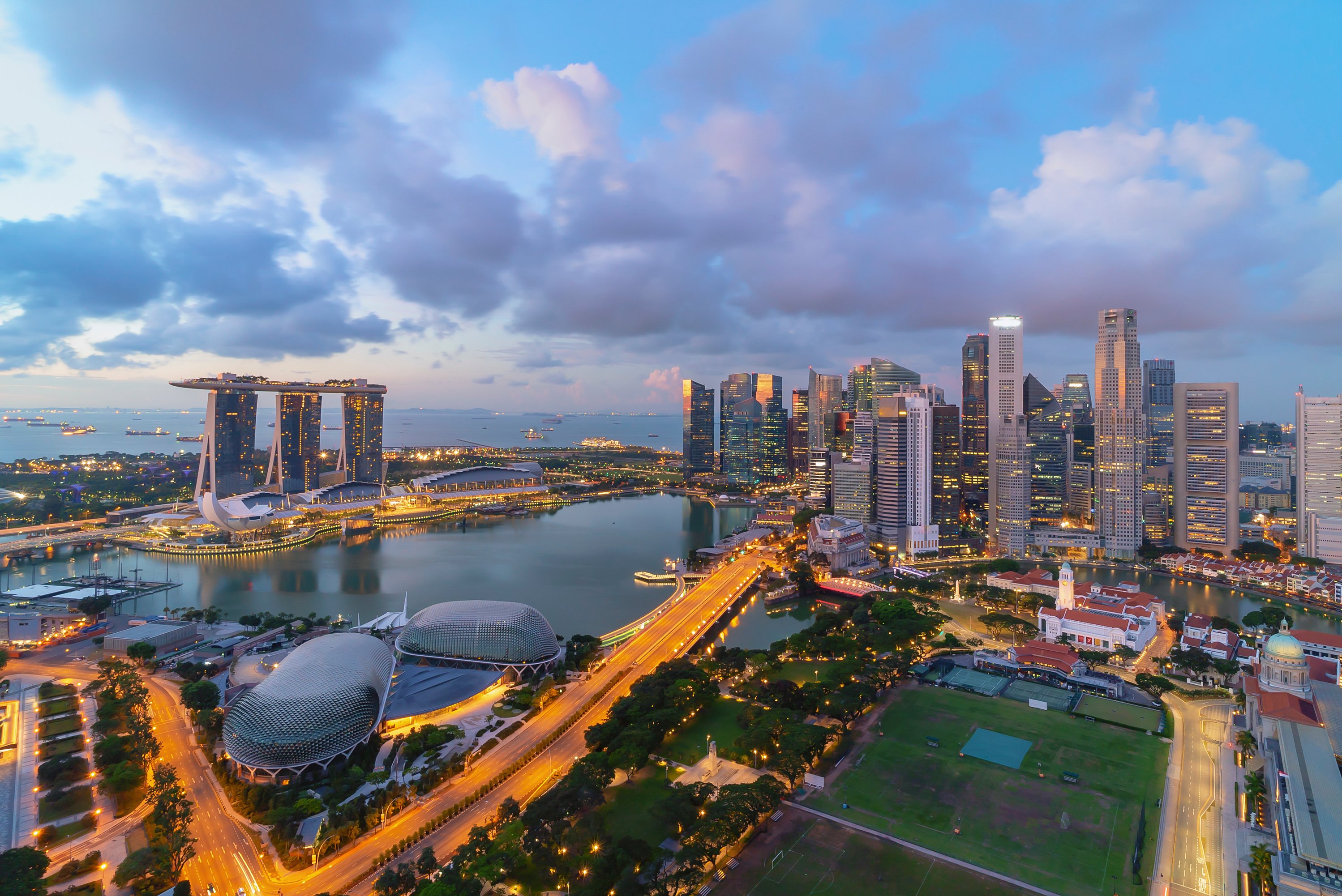 Singapore landmark city skyline, with iconic three tower Marina Bay Sands, during sunrise