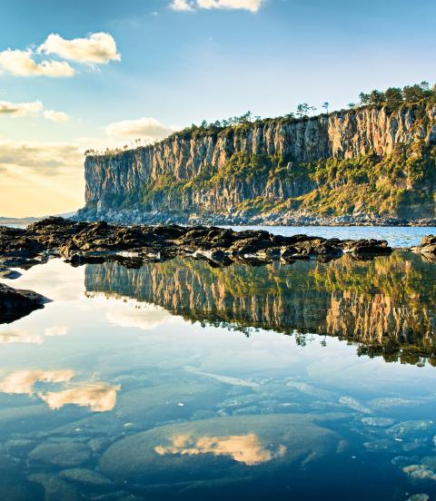 A reflection of coastal cliffs