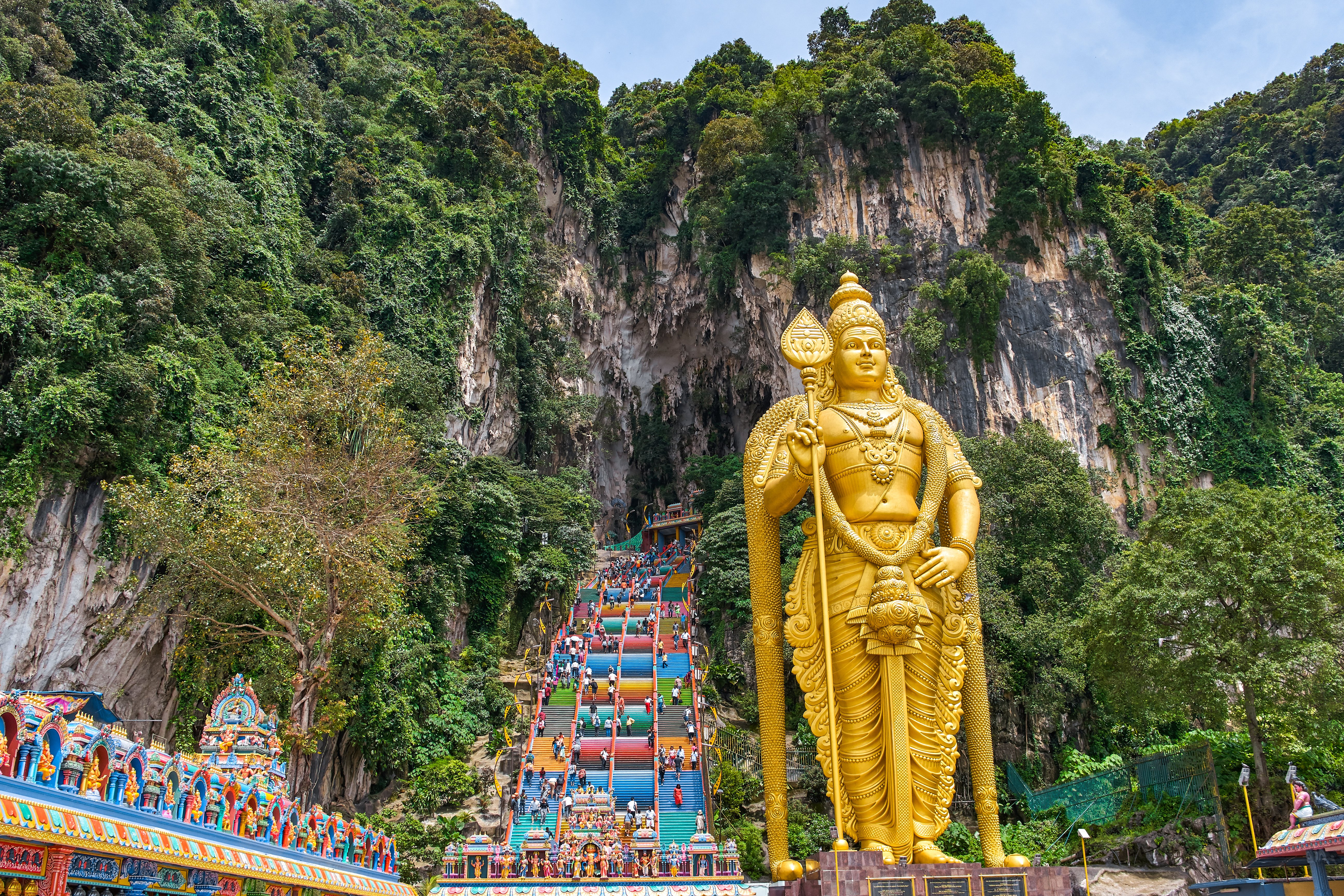 272 colorful stairs lead up to the Batu Caves with the Lord Murugan Statue, 42m tall, in the foreground