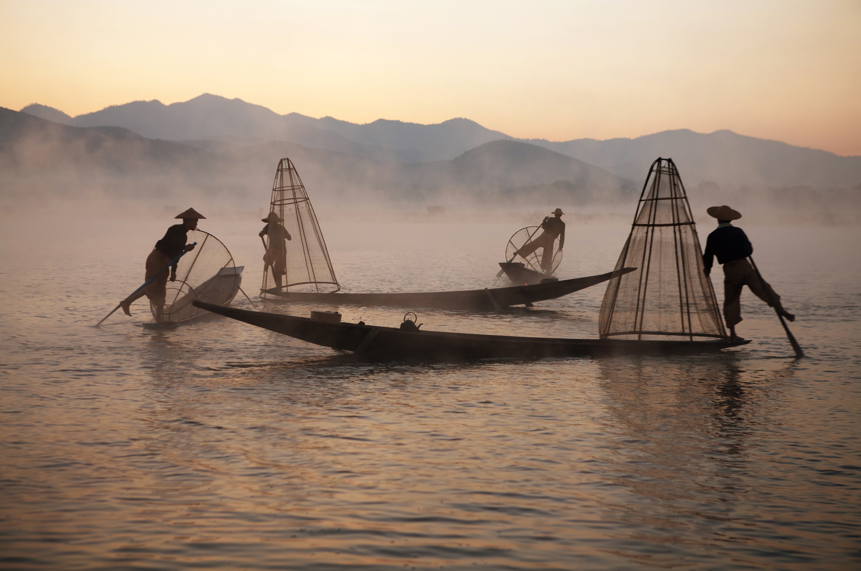 Fishermen on Inle lake, Myanmar - The lake is notable for its high number of endemic species