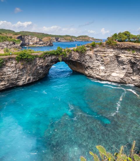 Stone arch over the sea called Broken beach on Nusa Penida ,Indonesia