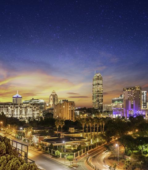 Sandton city at night with twilight and stars in the sky, Gauteng Johannesburg