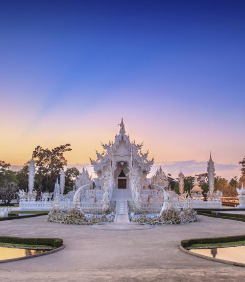 Evening view of Wat Rong Khun or White Temple in Chiang Rai, Thailand