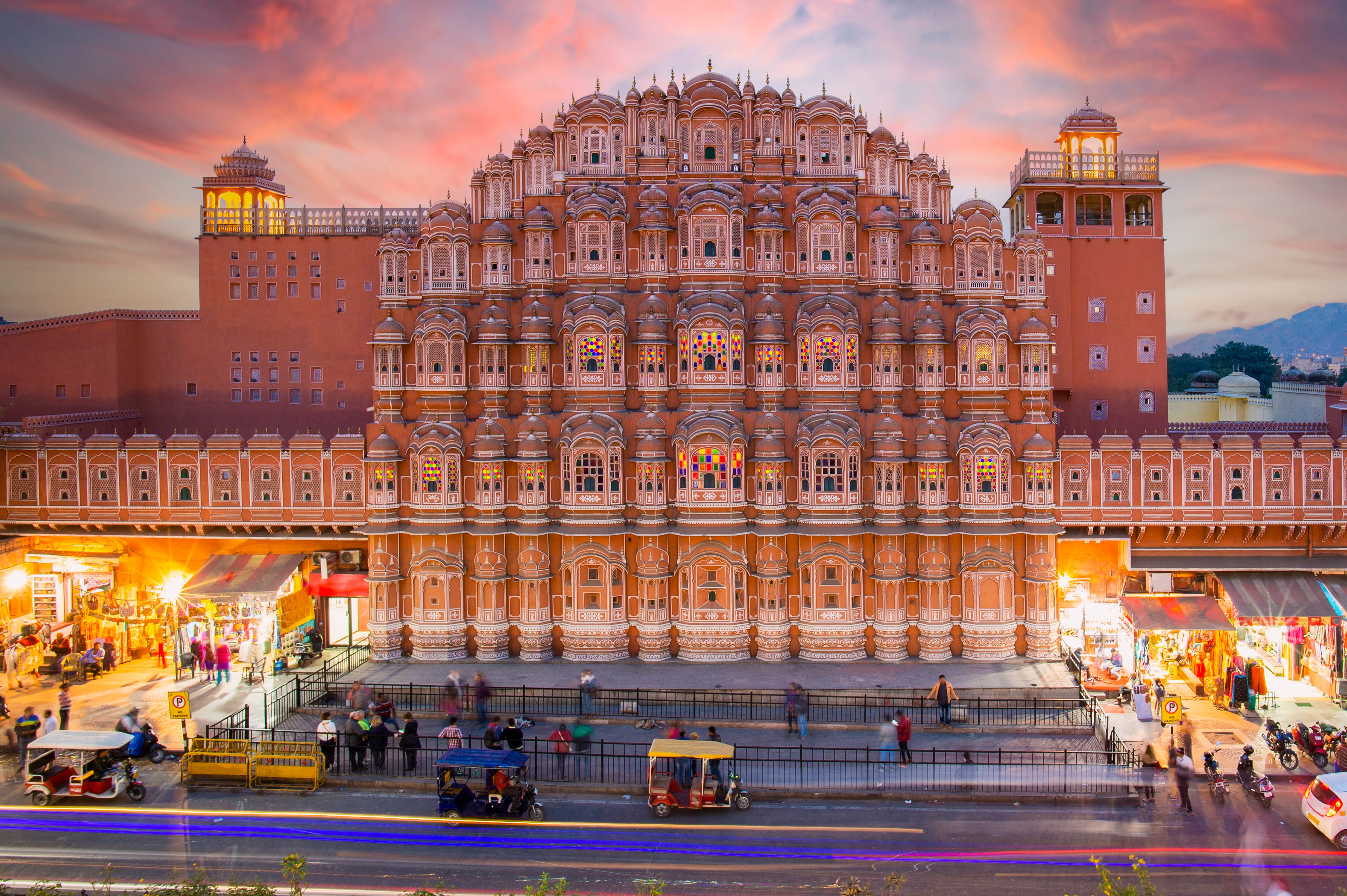 Hawa Mahal Palace at sunset with blurred people walking. Jaipur, India.