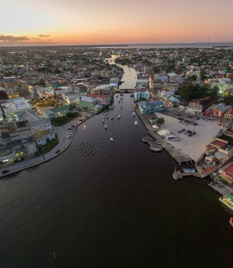 Evening sunset cityscape of Belize City with Caribbean Sea in background