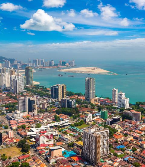 Panoramic aerial view of the city of Georgetown, with the straits of Malacca and Indian Ocean in the background