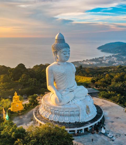 Aerial view of Big Buddha viewpoint at sunset on Phuket with a view of the water and coast below