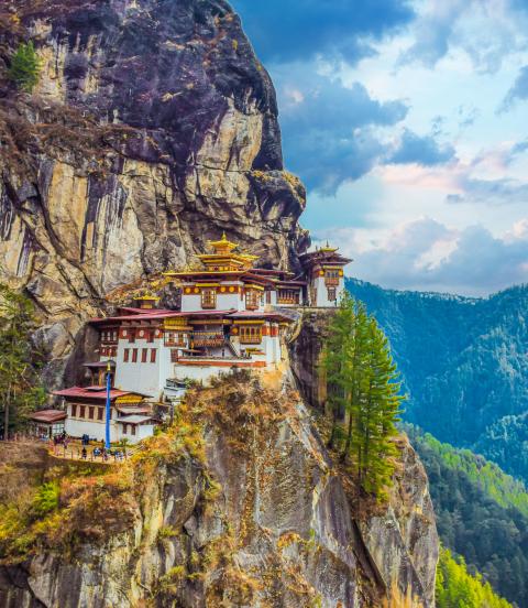 The Taktsang Palphug (Tiger’s Nest) monastery clings to cliffs 1200m above the forested Paro Valley