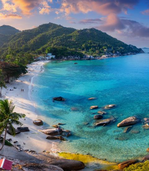 Bay and beach at sunset, stunning colours of the sky and water