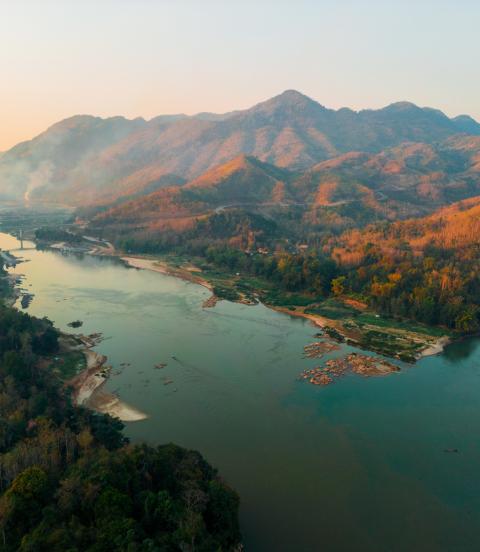 Aerial view of tranquil scene of river at sunset