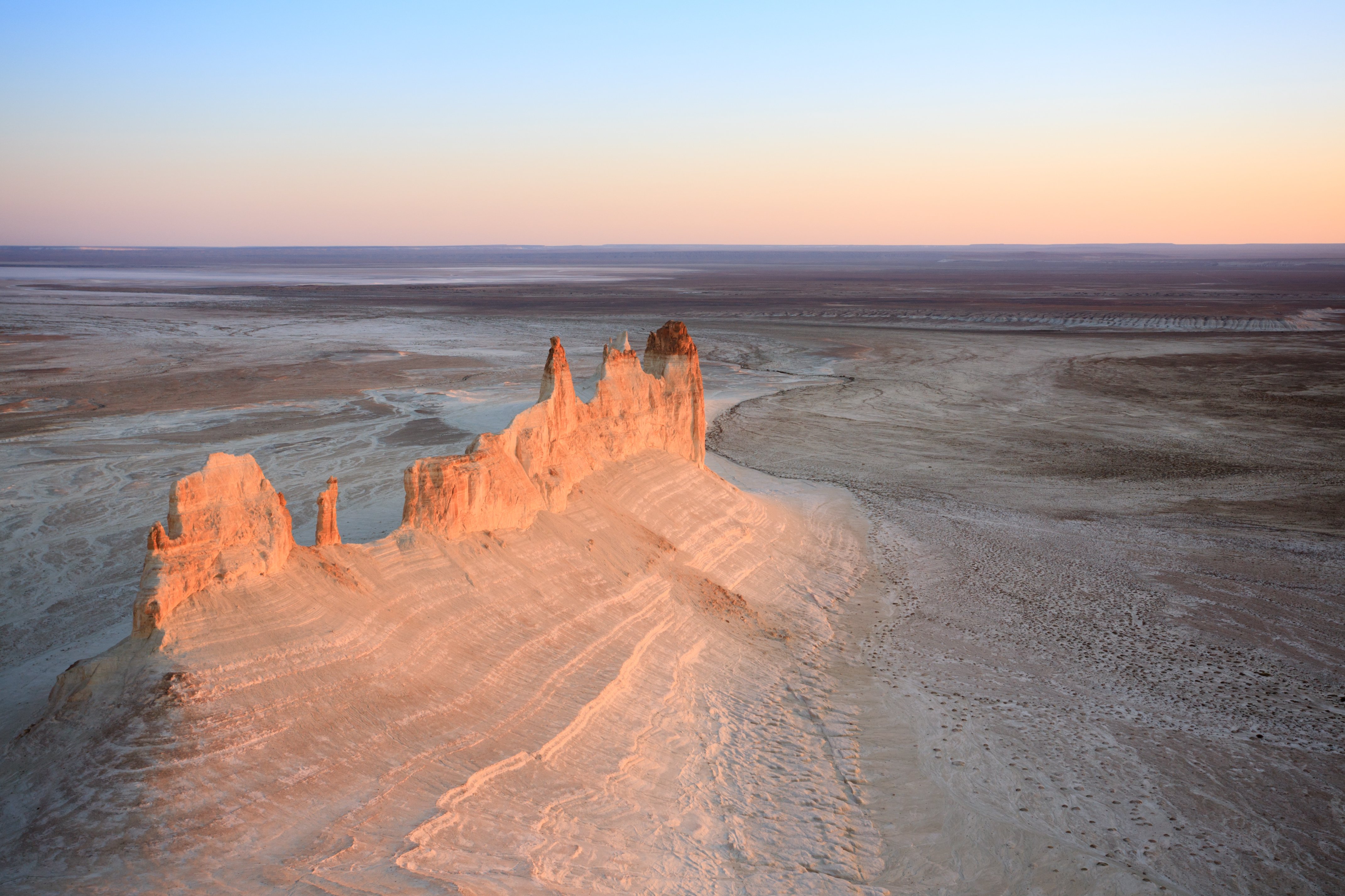 Panorama of hills and ridges with limestone and chalk slopes in the Kazakh steppe, relief folds in the desert tract of Boszhira