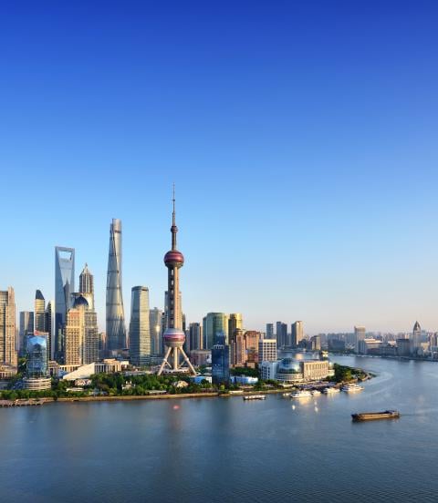 Shanghai skyline in blue sky at sunset