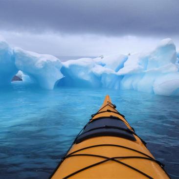A kayak amongst the icebergs, Antarctic