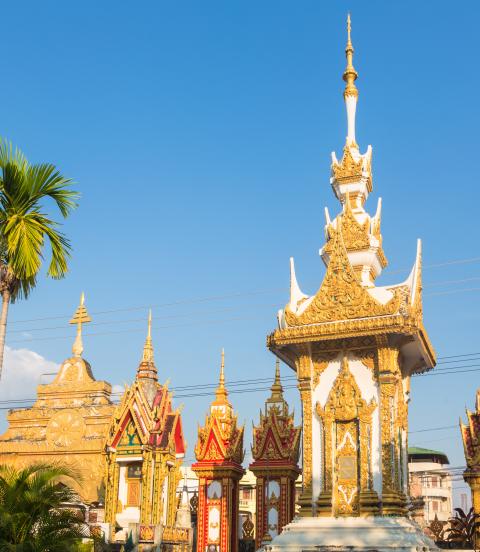 Buddhist stupas with palm trees