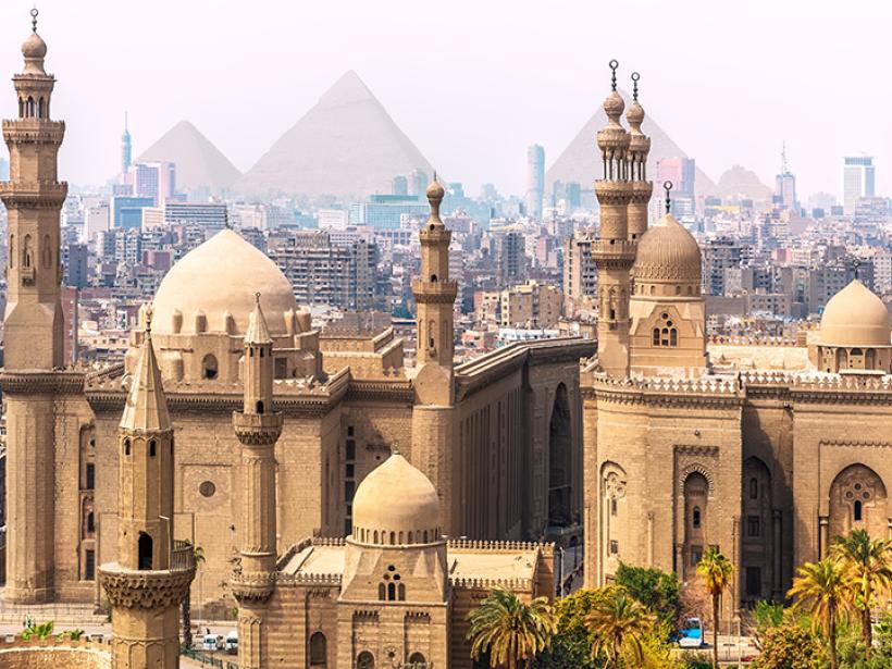 Explore the culture and architecture of Cairo with the iconic pyramids of GIza serving as the backdrop