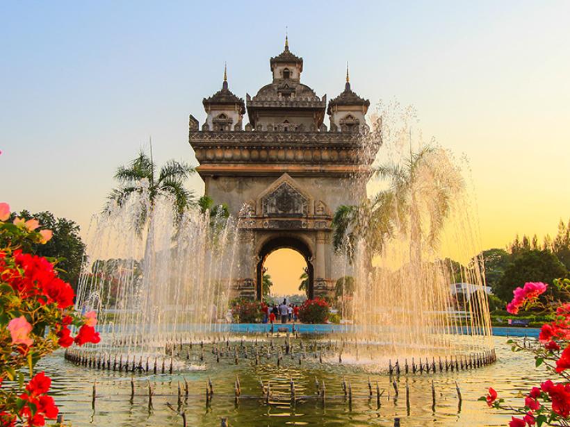 Pay respect at the Patuxai Gate, a monument built to honour the lives of those who fought for the Independence from France