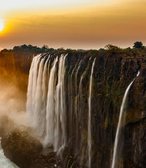 Panorama of Victoria Falls at sunset.