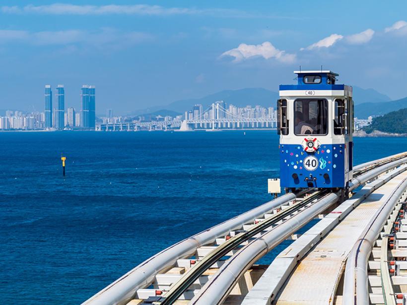 Witness the vibrant blue waters around Busan when taking the Sky Capsule