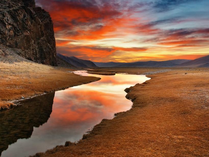 A Mongolian desert sunrise a highlight of many Mongolia tours.