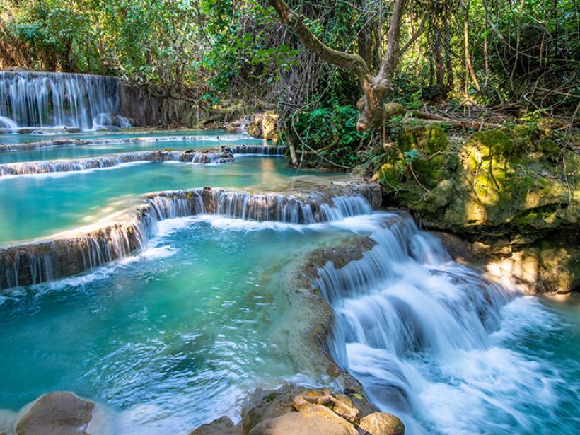Go for a dip in the Kuang Si Falls, known for their brilliant turquoise shade