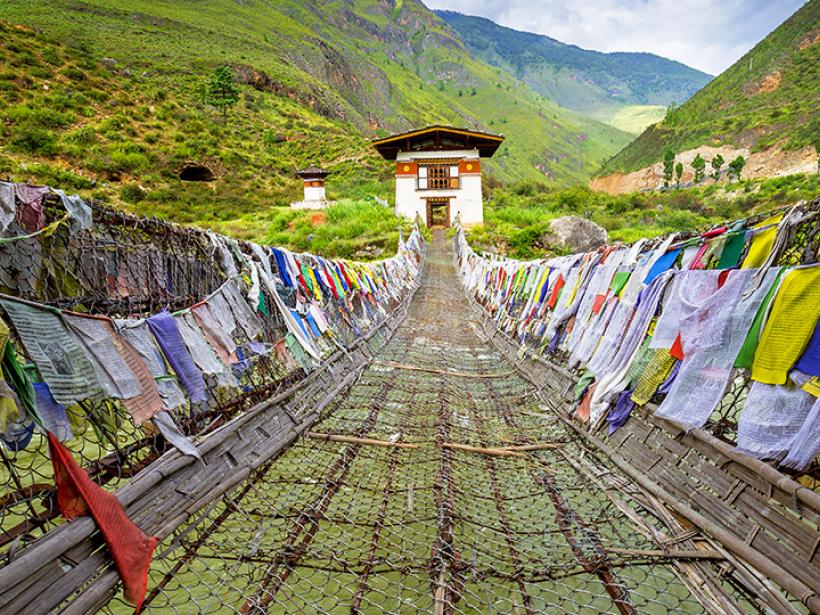 Walk across the Punakha Suspension Bridge, one of the oldest suspension bridges in the world